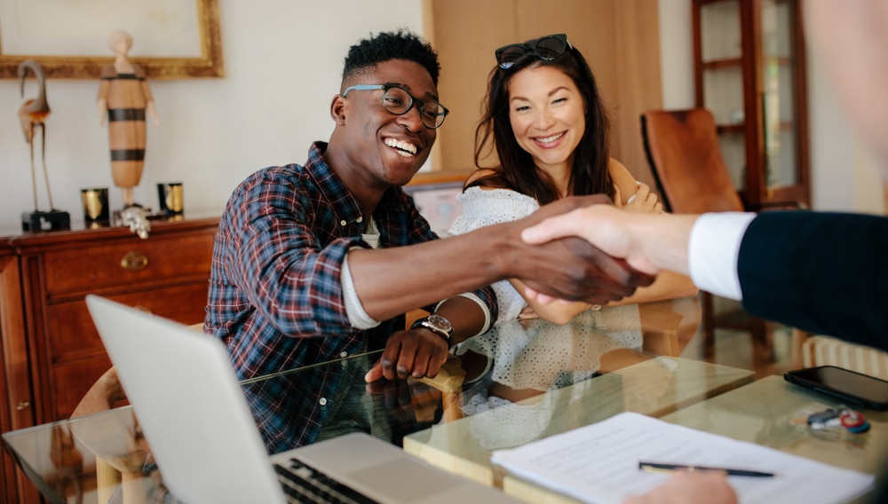 Happy,Property,Owners,Shaking,Hands,With,Real,Estate,Broker,After
